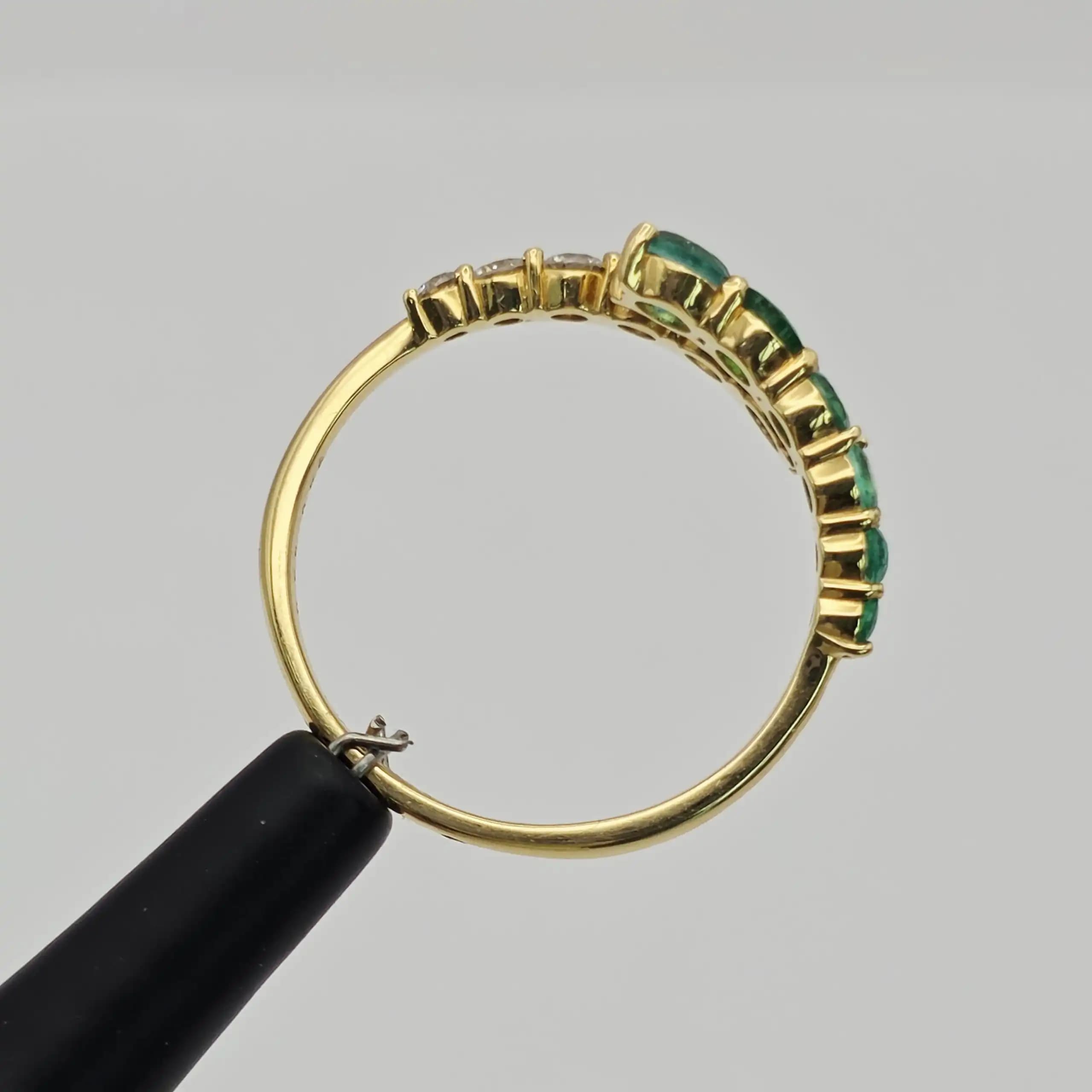 0.49 cts oval natural emerald and diamond band ring in 18K yellow gold
