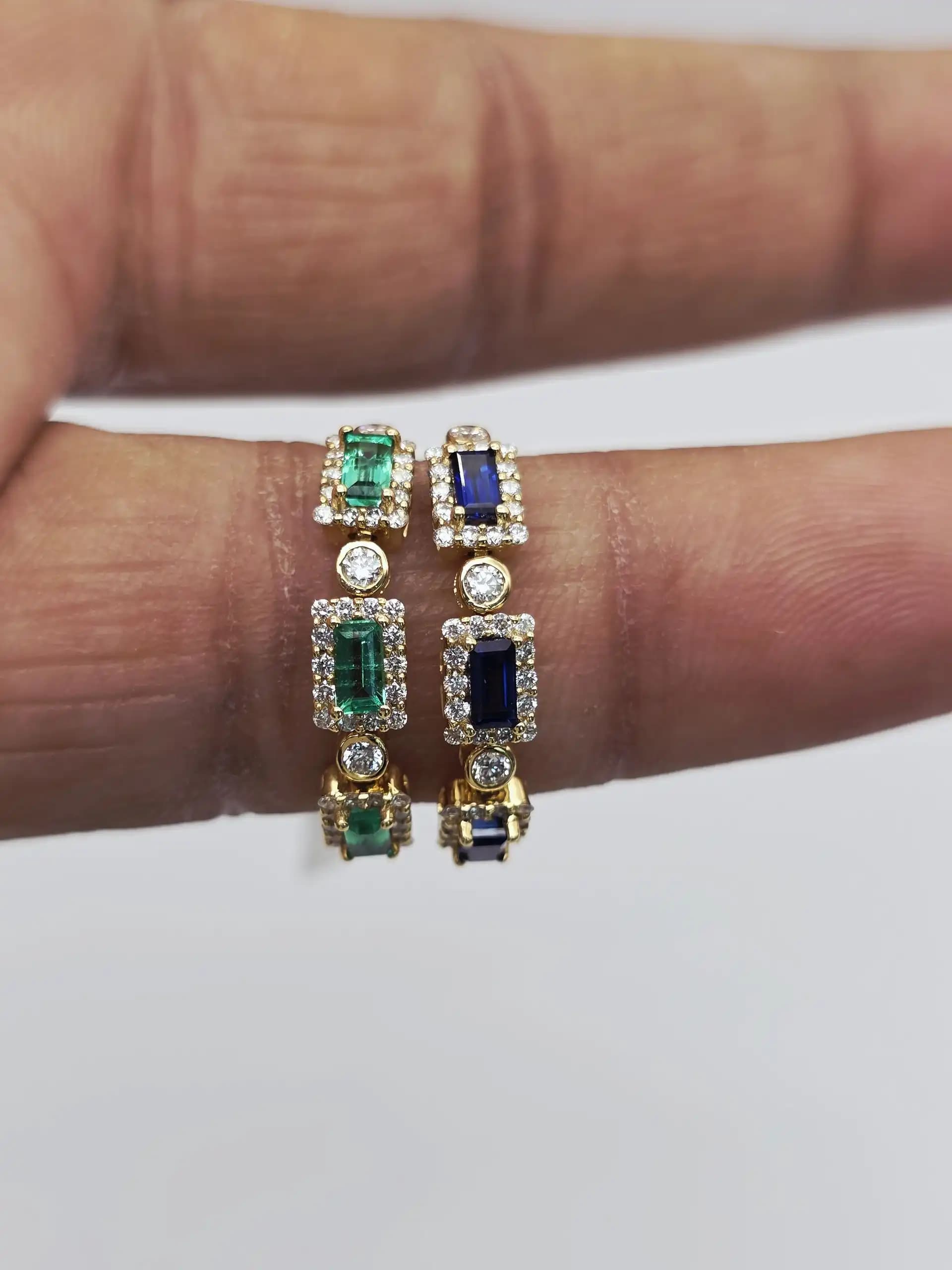 0.45 cts emerald cut natural emerald and diamond three stone ring in 18K yellow gold