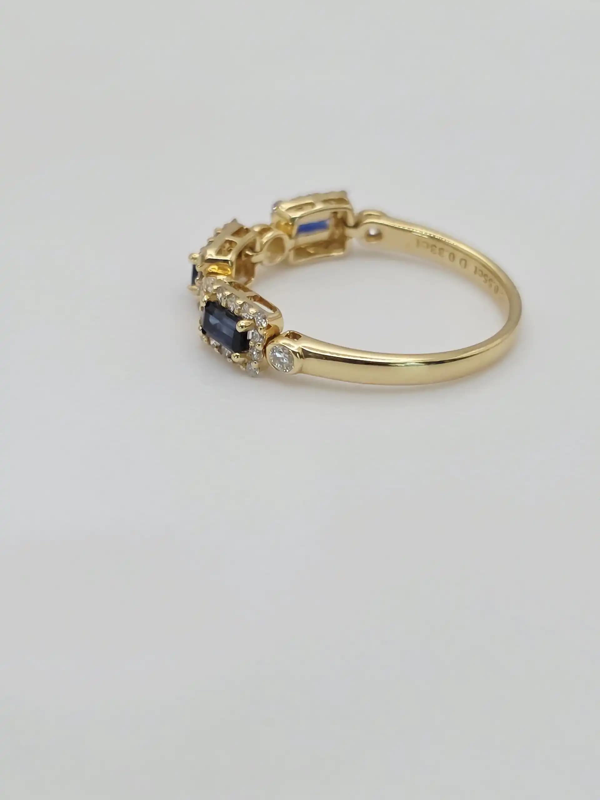 0.55 cts emerald cut natural blue sapphire and diamond band ring in 18K yellow gold