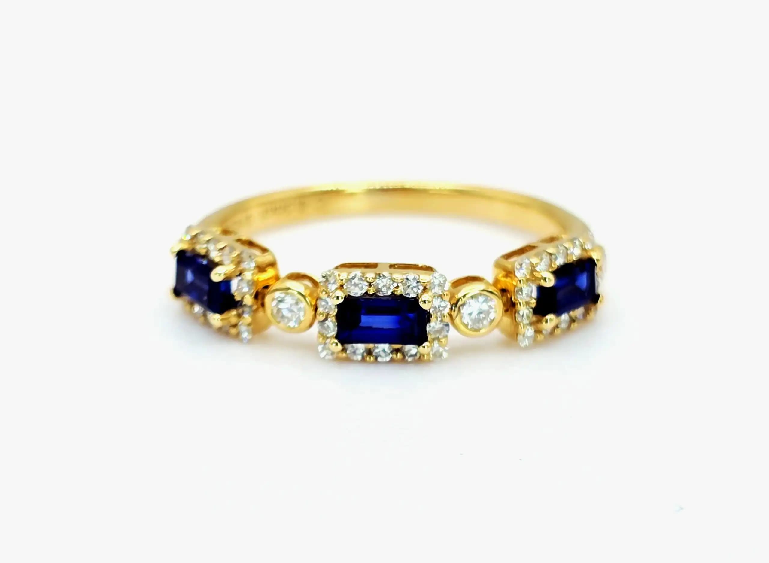 0.55 cts emerald cut natural blue sapphire and diamond band ring in 18K yellow gold