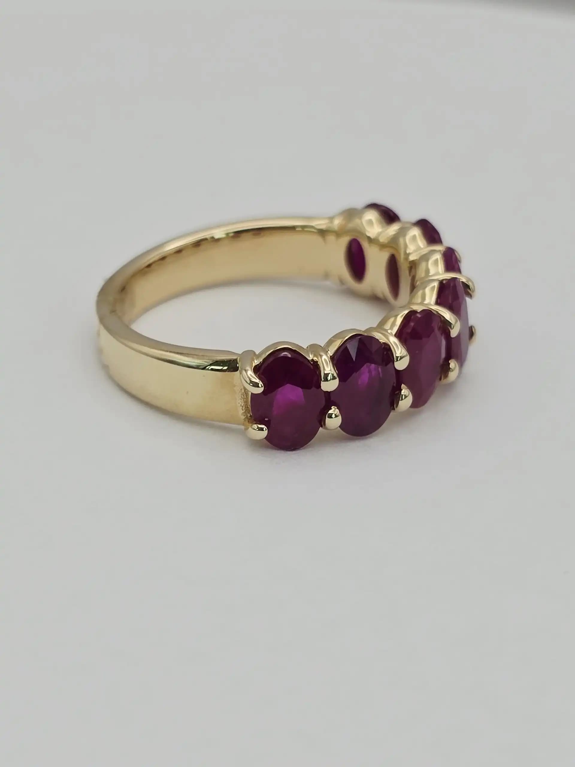 3.58 cts oval natural ruby half eternity ring in 14K yellow gold