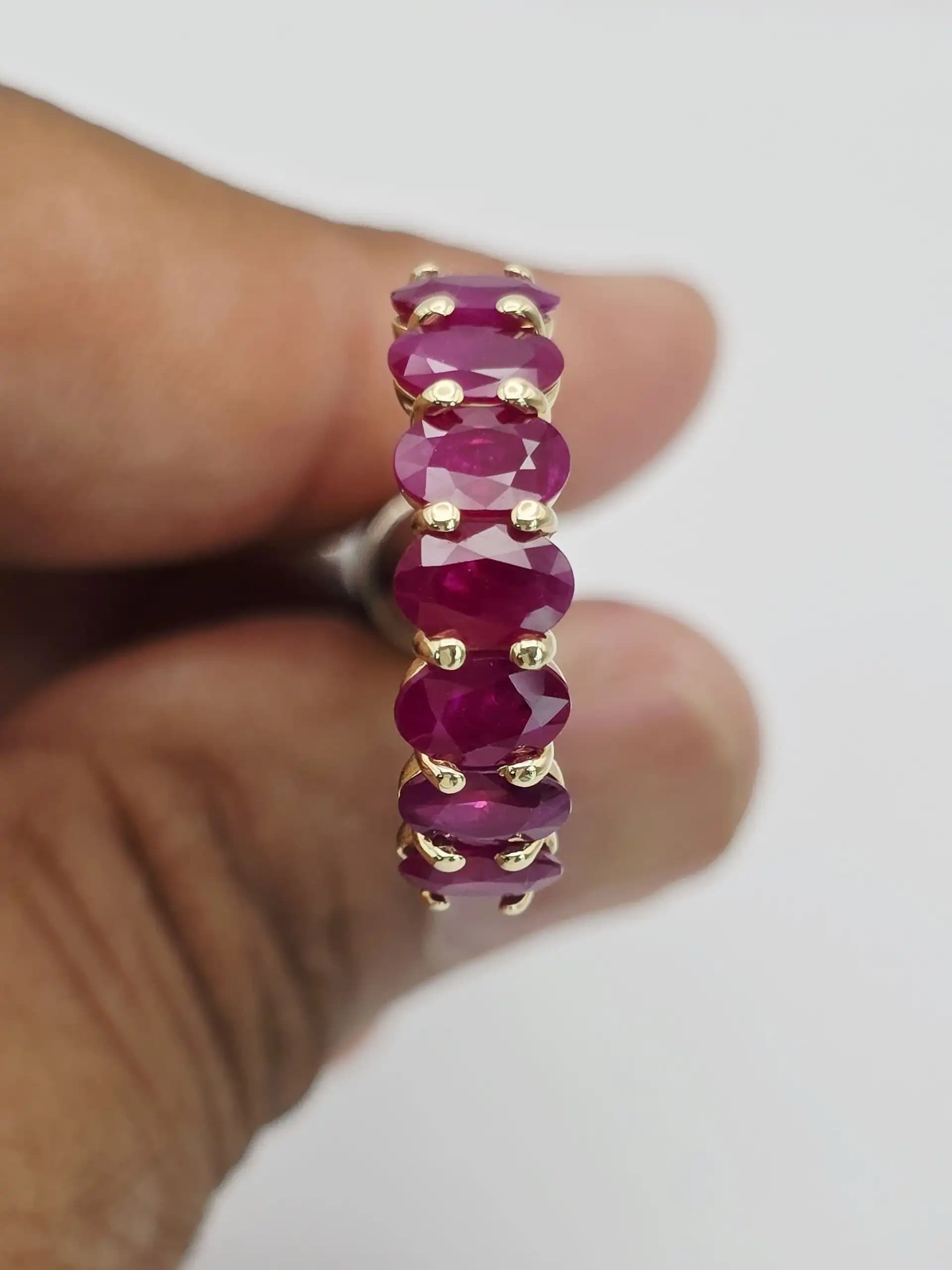 3.58 cts oval natural ruby half eternity ring in 14K yellow gold