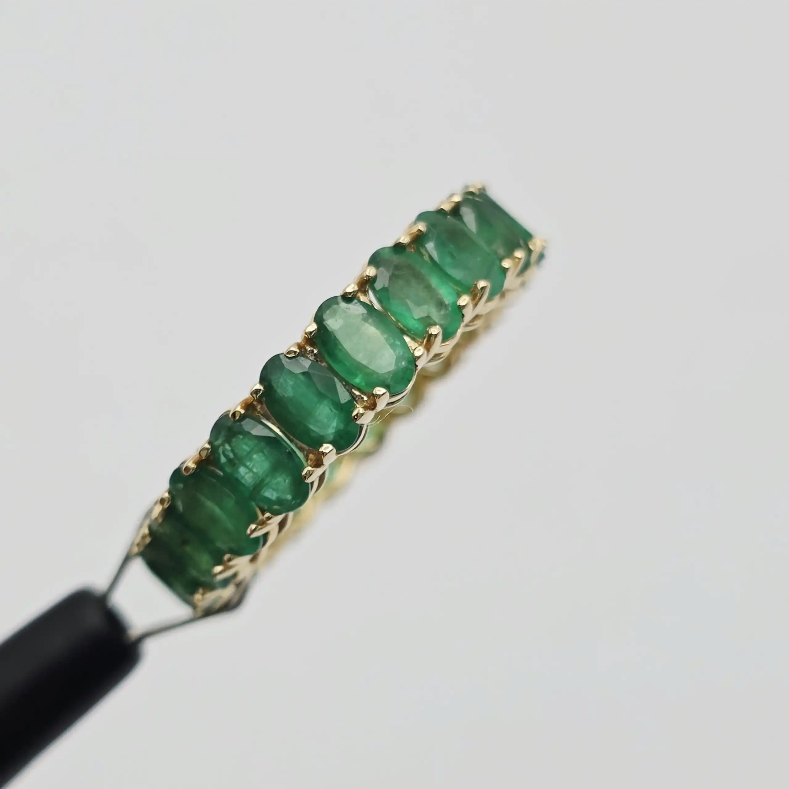6.24 cts oval natural emerald full eternity ring in 14K yellow gold