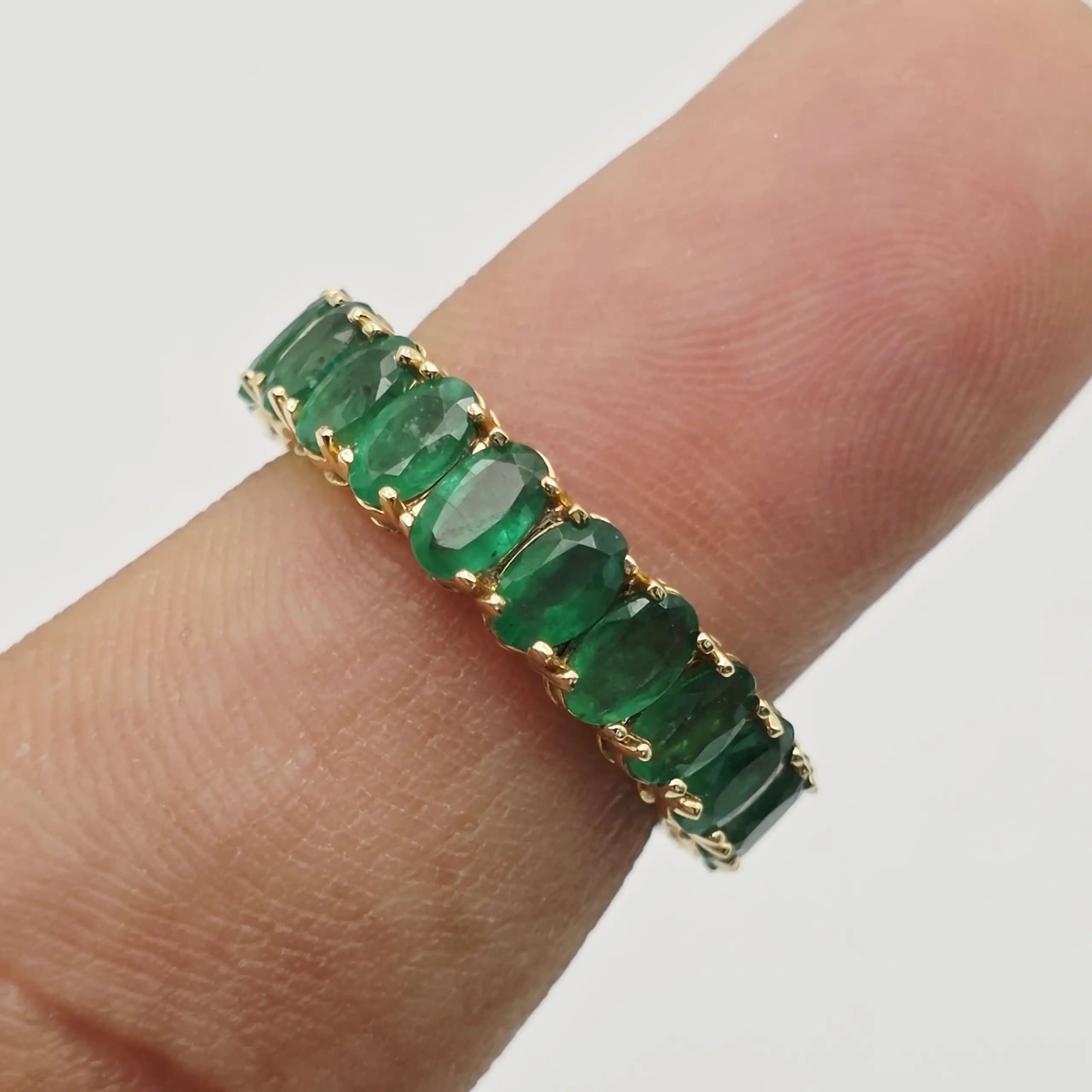 6.24 cts oval natural emerald full eternity ring in 14K yellow gold