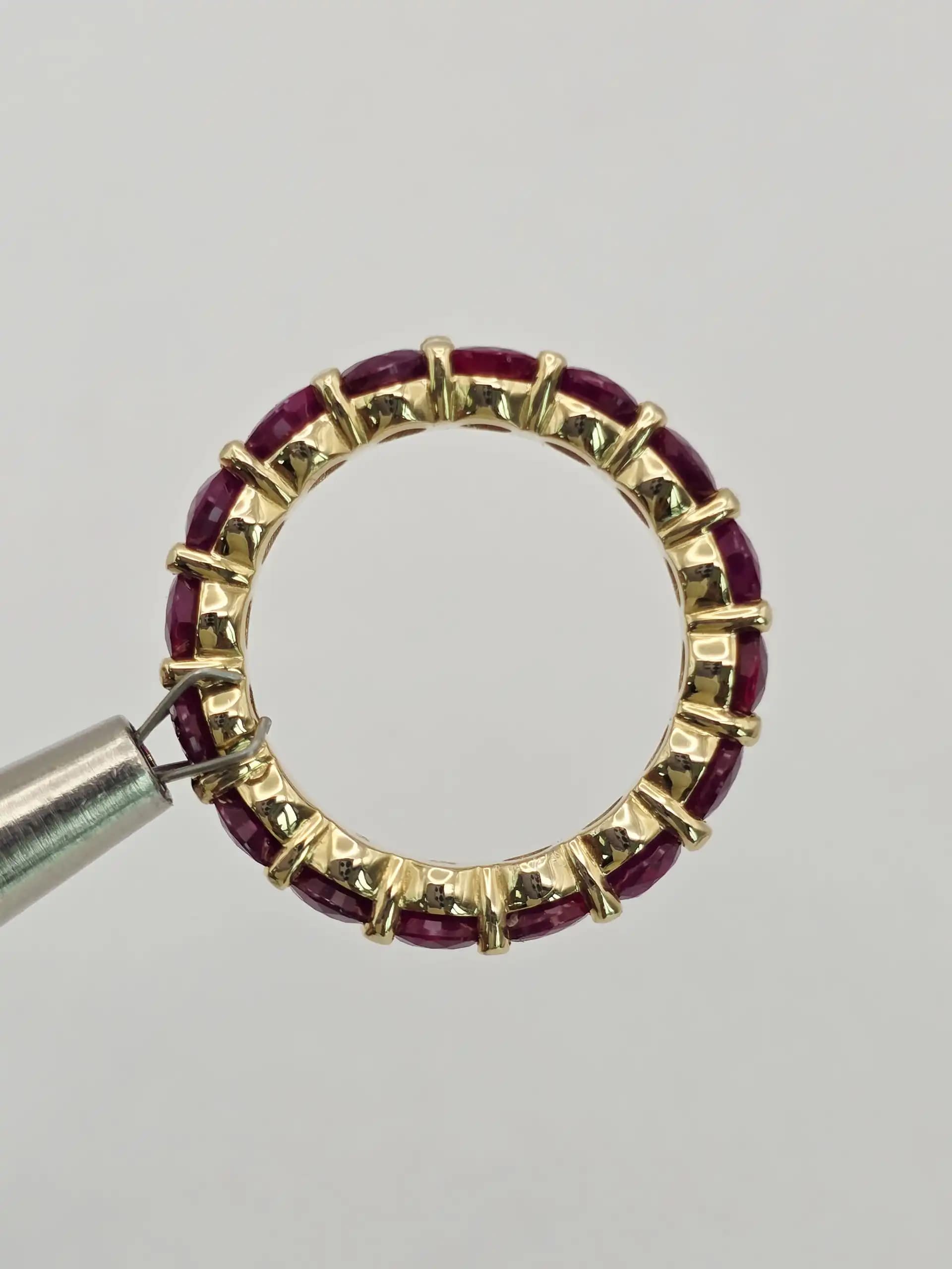 5.10 cts emerald cut natural ruby and diamond eternity ring in 14K white gold