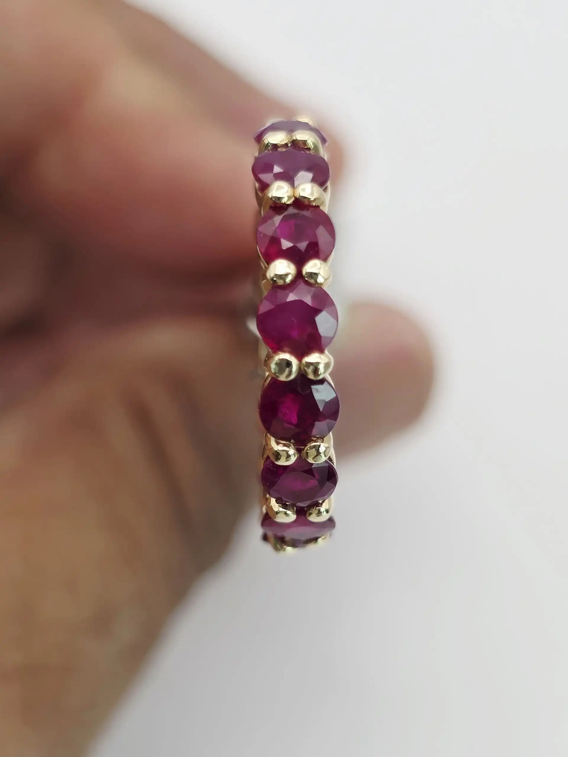 5.10 cts emerald cut natural ruby and diamond eternity ring in 14K white gold