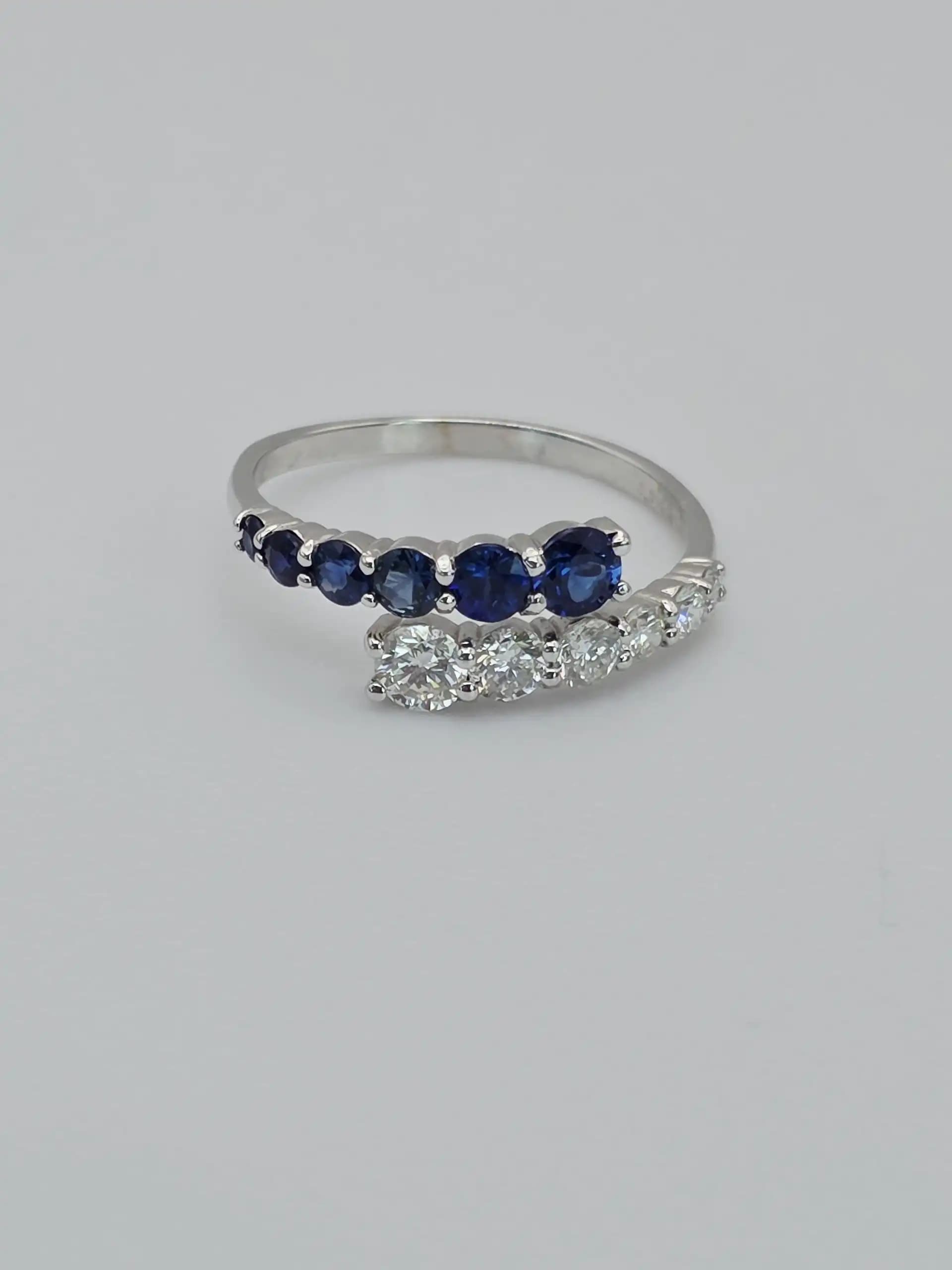 0.64 cts natural blue sapphire and diamond half eternity ring in 18K white gold