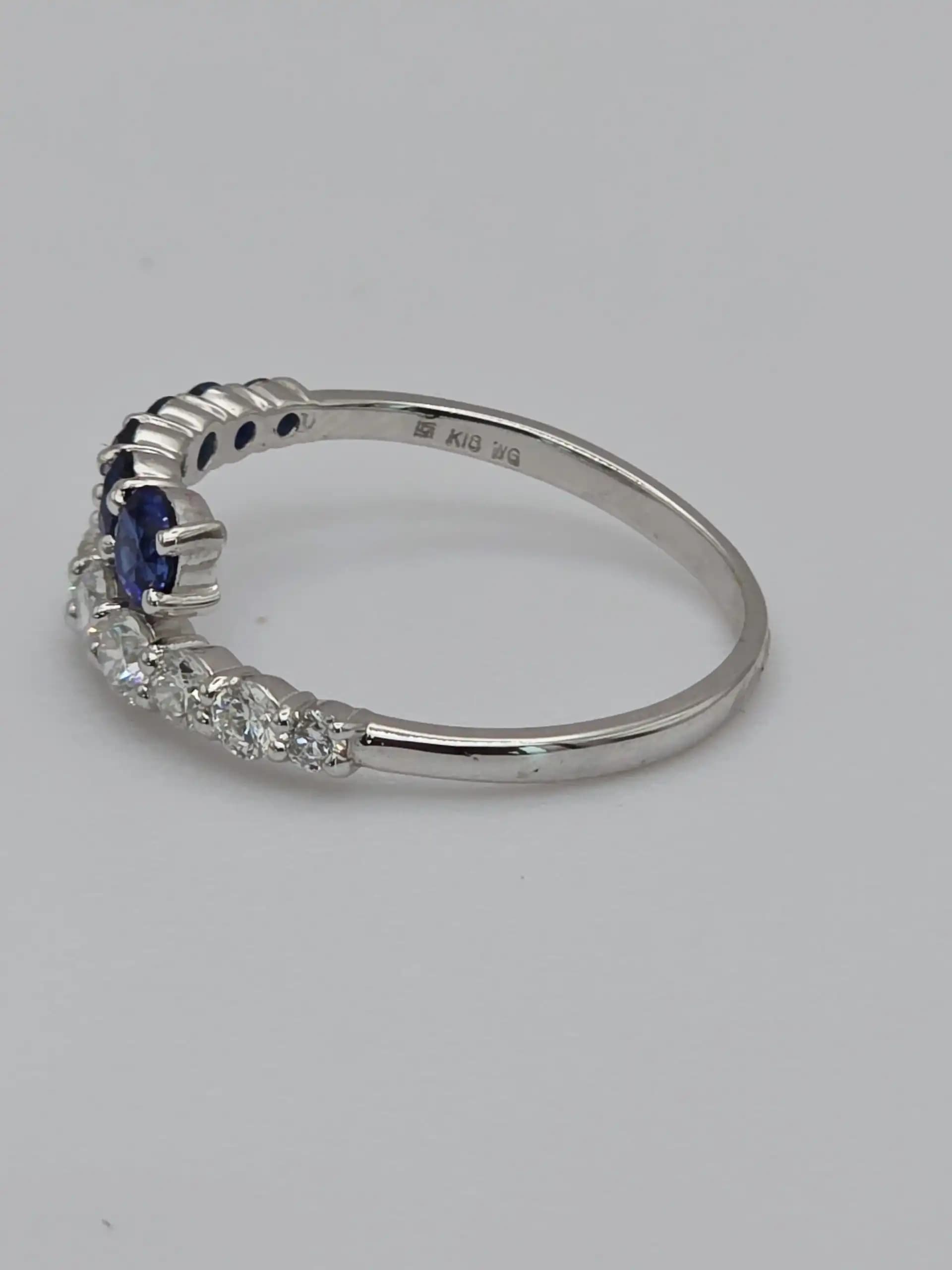 0.64 cts natural blue sapphire and diamond half eternity ring in 18K white gold