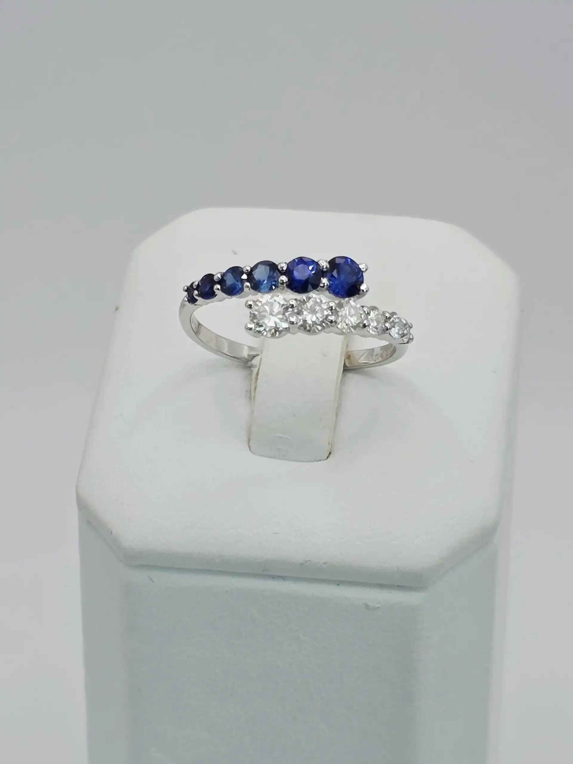 0.64 cts natural blue sapphire and diamond bypass ring in 18K yellow gold