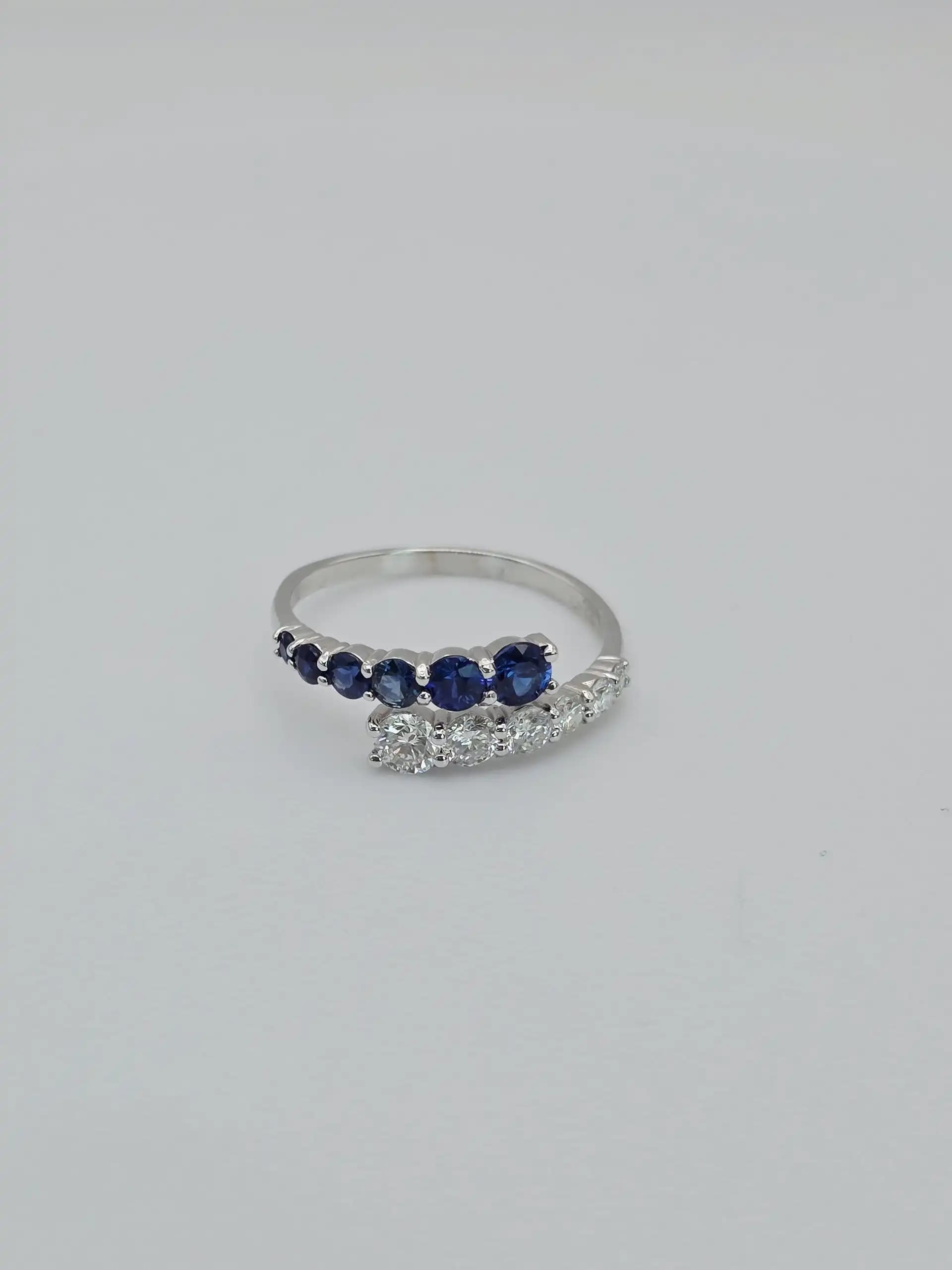0.64 cts natural blue sapphire and diamond bypass ring in 18K yellow gold
