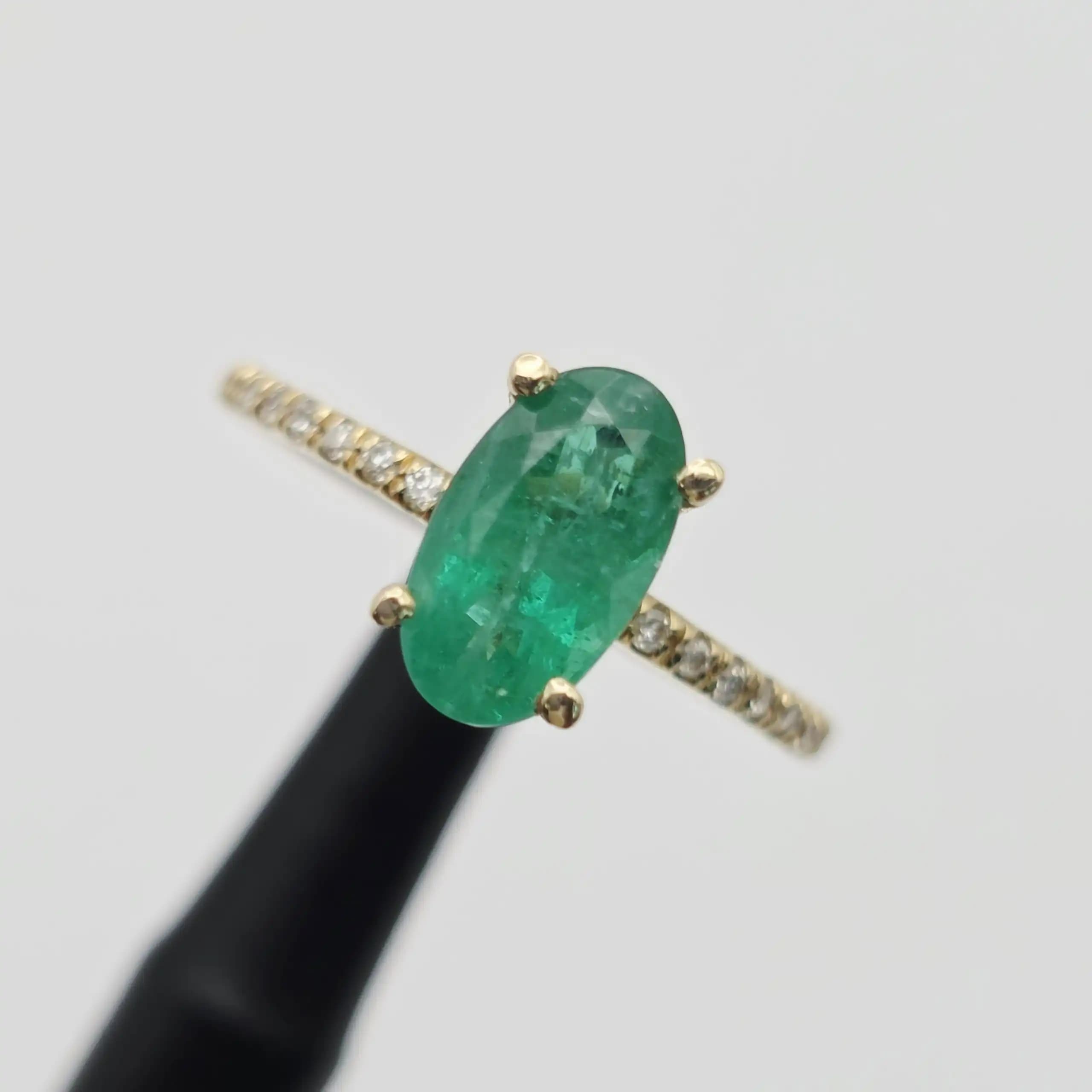 1.52 cts oval natural emerald solitaire ring with pave band in 14K yellow gold