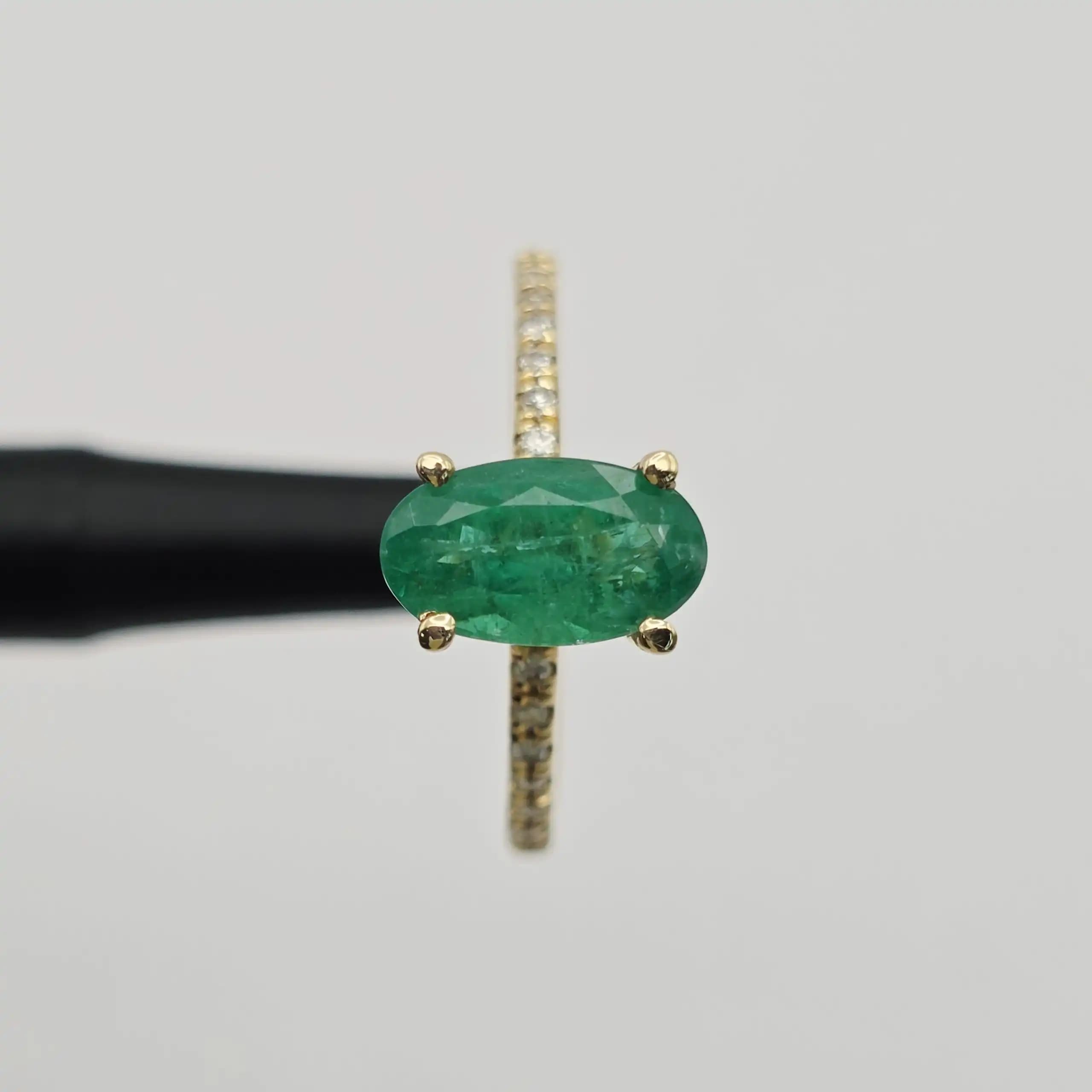 1.52 cts oval natural emerald solitaire ring with pave band in 14K yellow gold