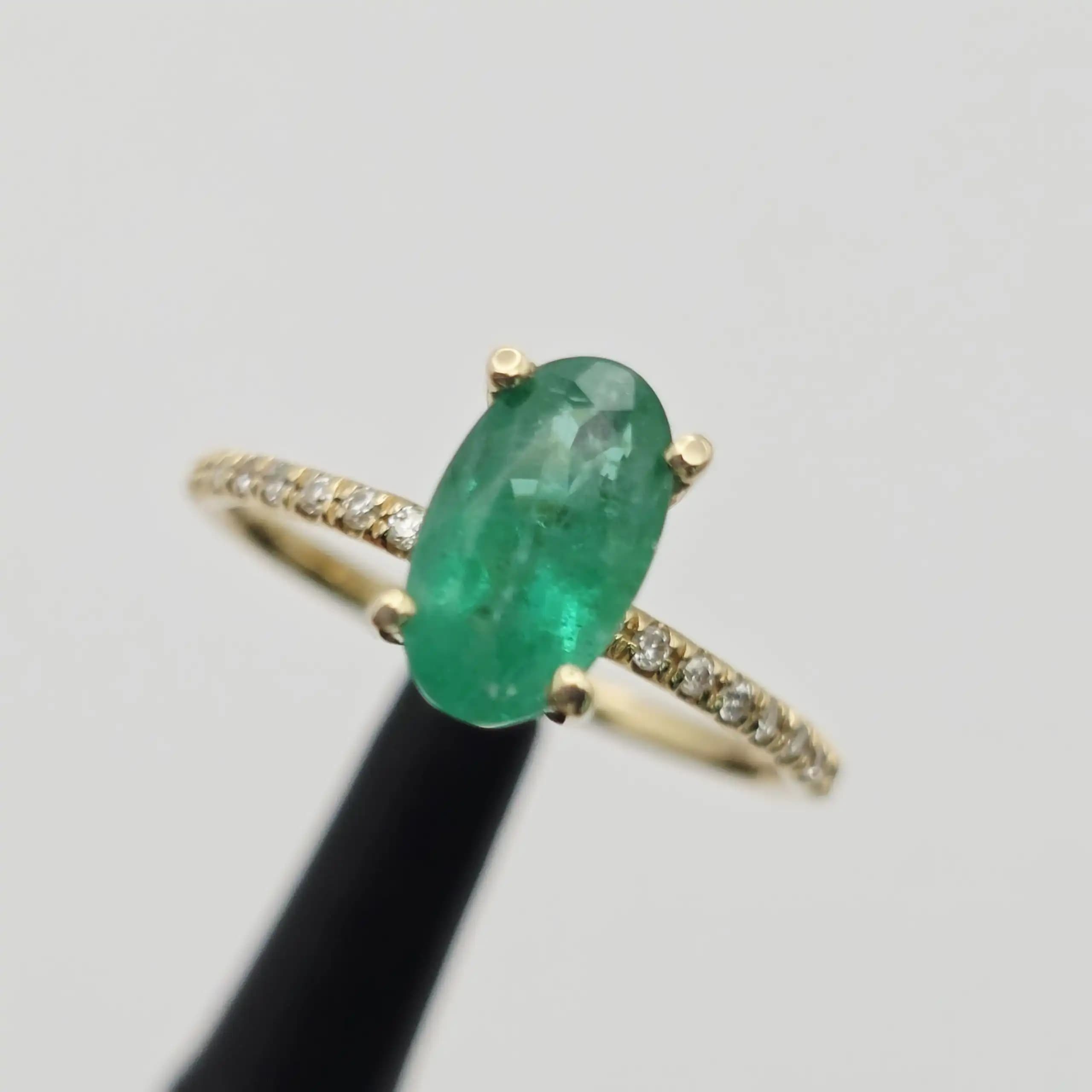 1.52 cts oval natural emerald solitaire ring with pave band in 14K yellow gold