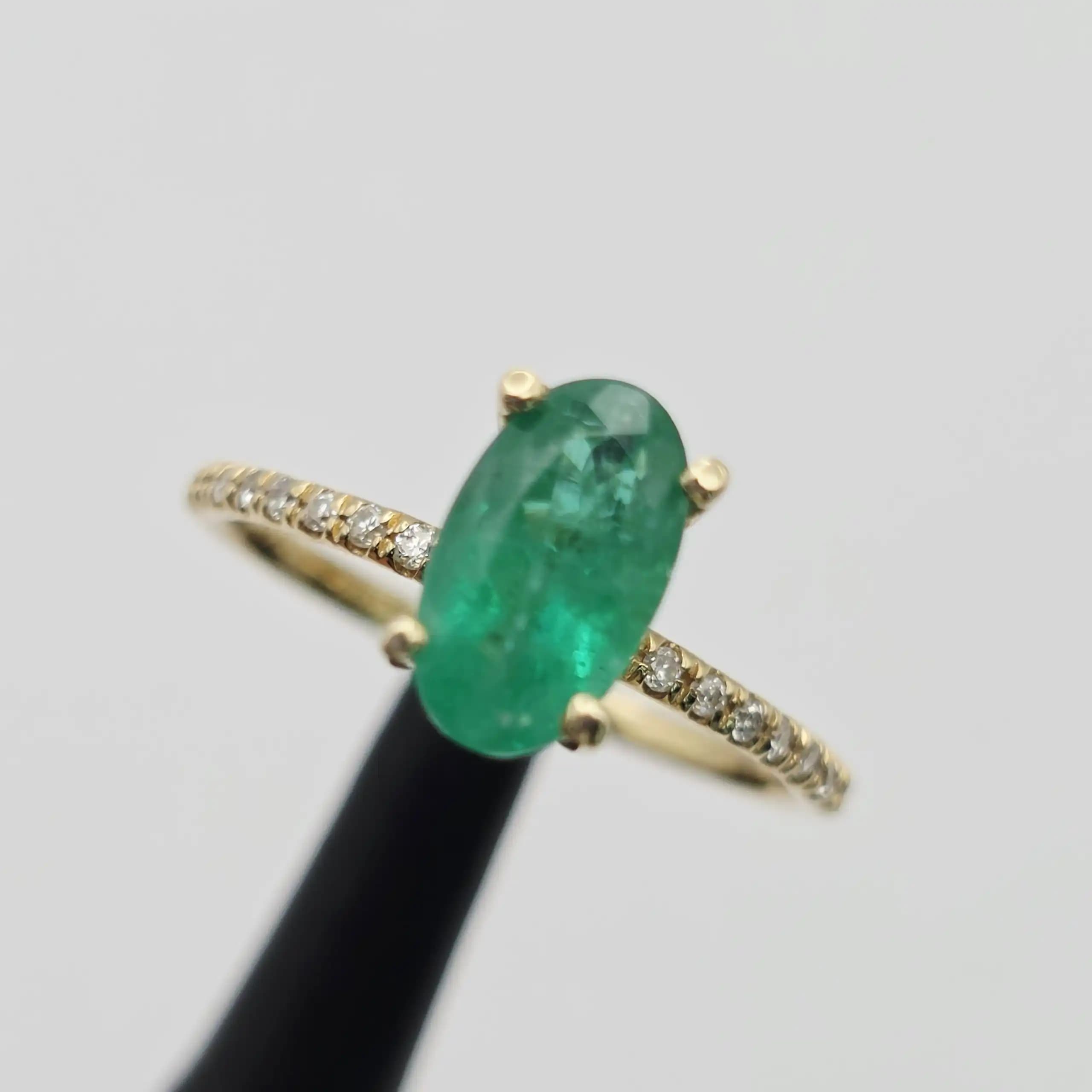 1.52 cts oval natural emerald solitaire ring with pave band in 14K yellow gold