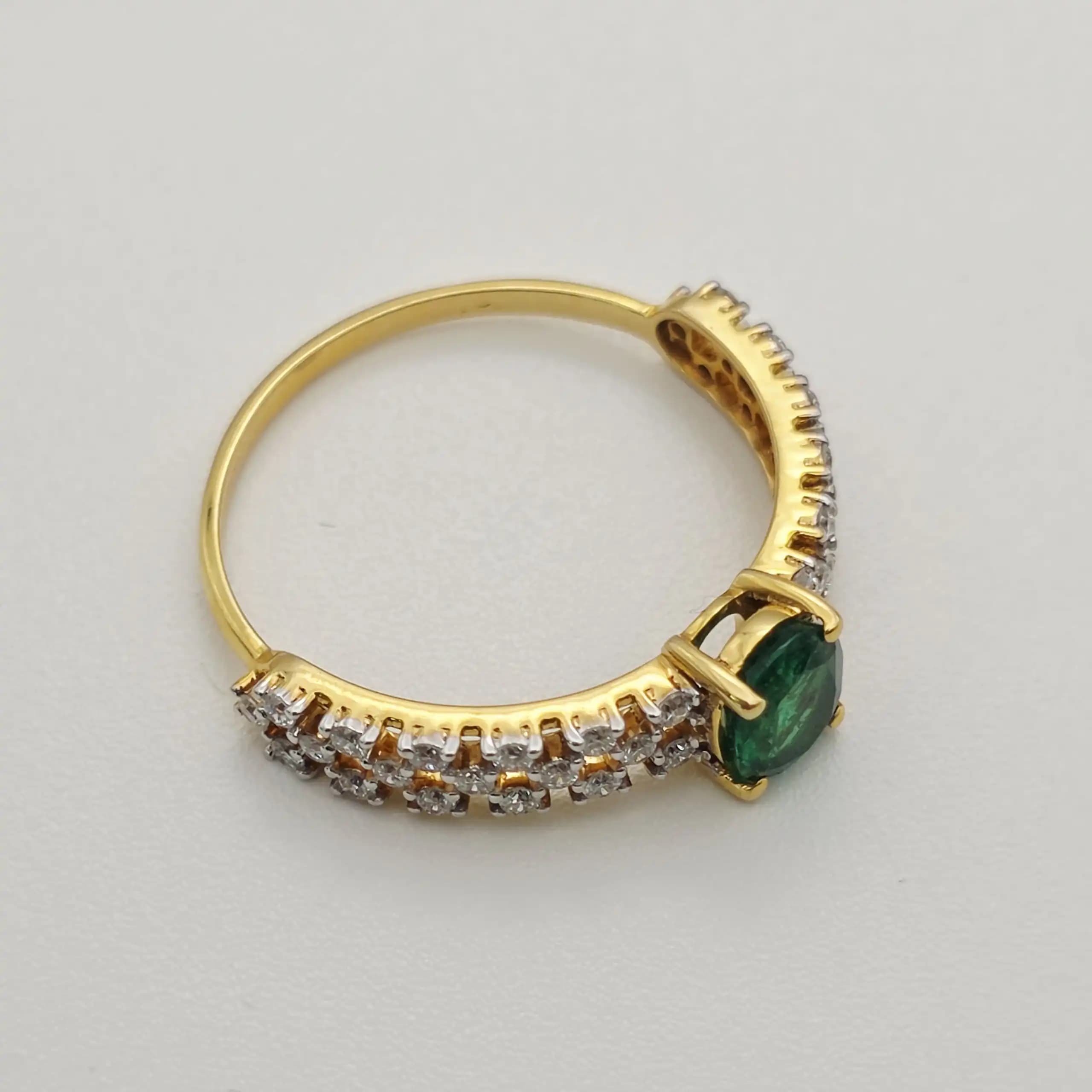0.53 cts oval natural emerald and diamond ring in 18K yellow gold