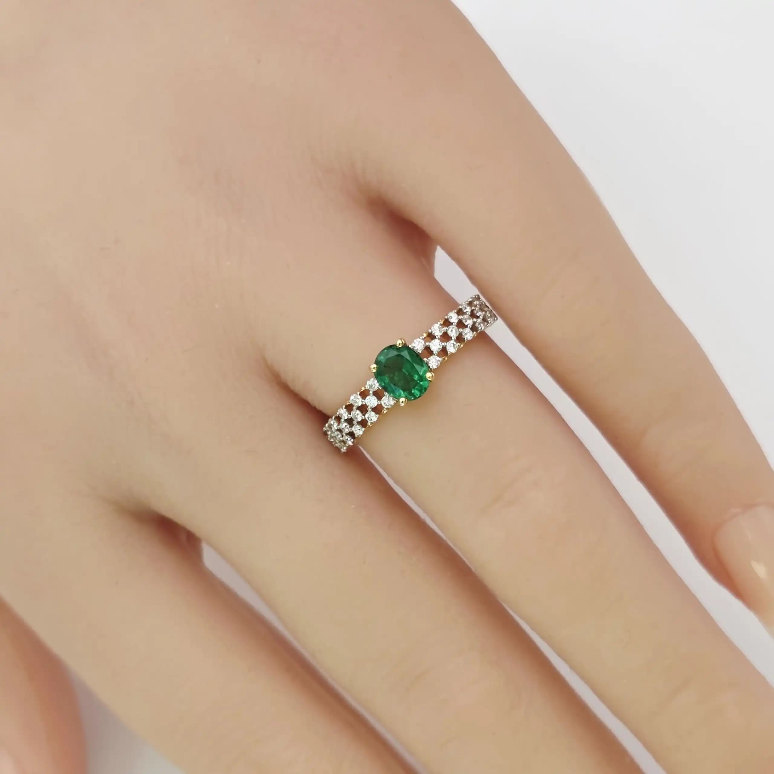 0.53 cts oval natural emerald and diamond ring in 18K yellow gold
