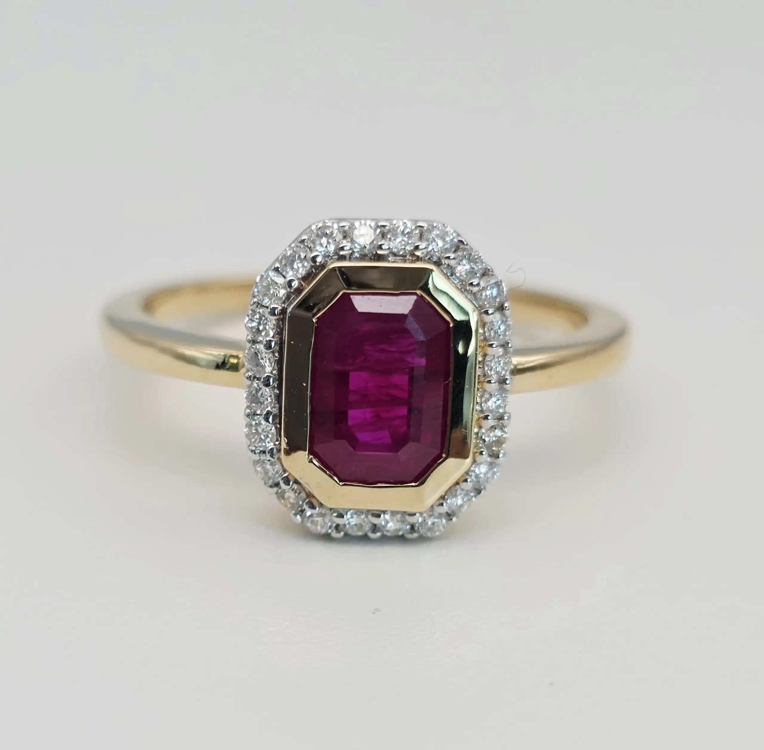 1.11 cts emerald cut natural ruby halo ring in 18K yellow gold