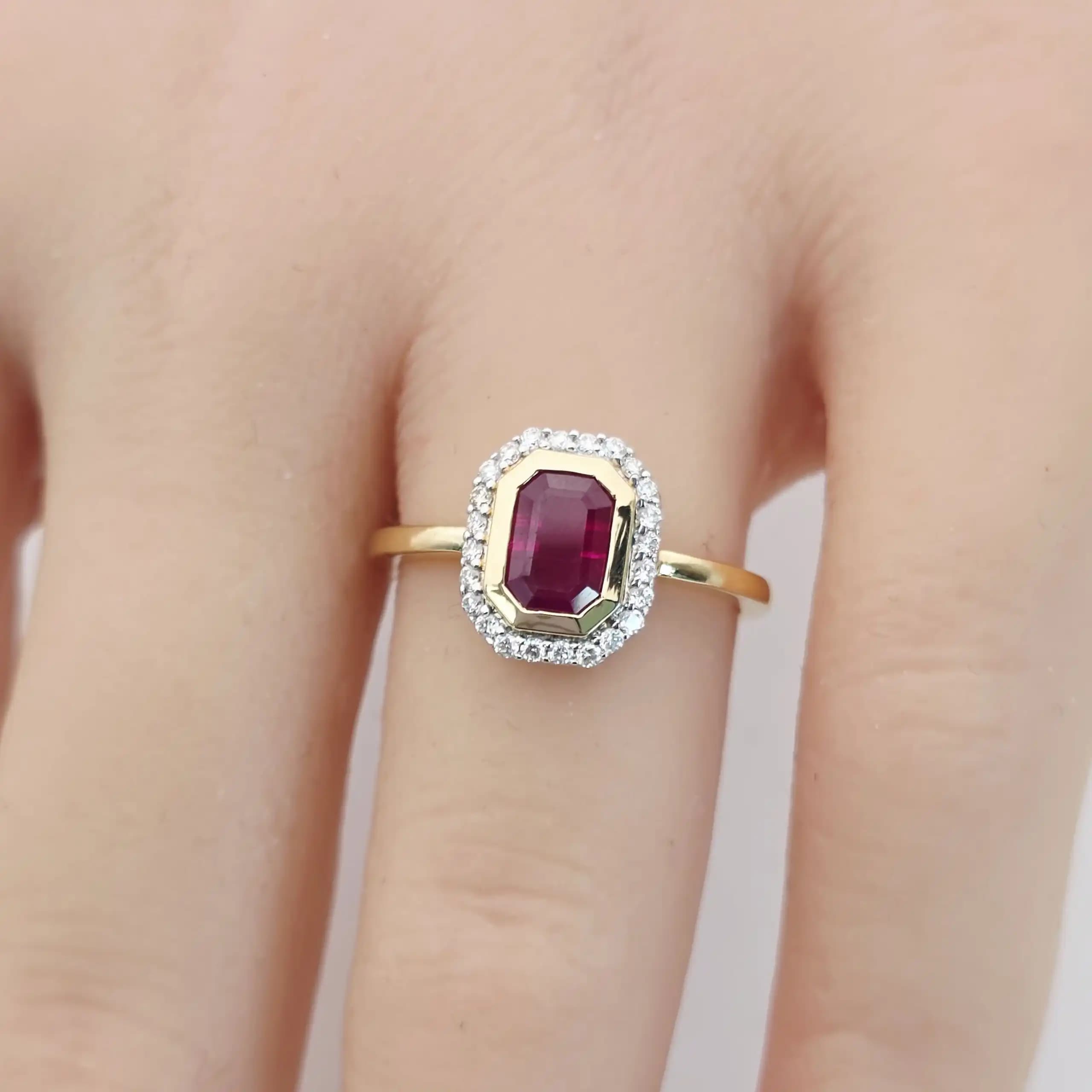 1.11 cts emerald cut natural ruby halo ring in 18K yellow gold