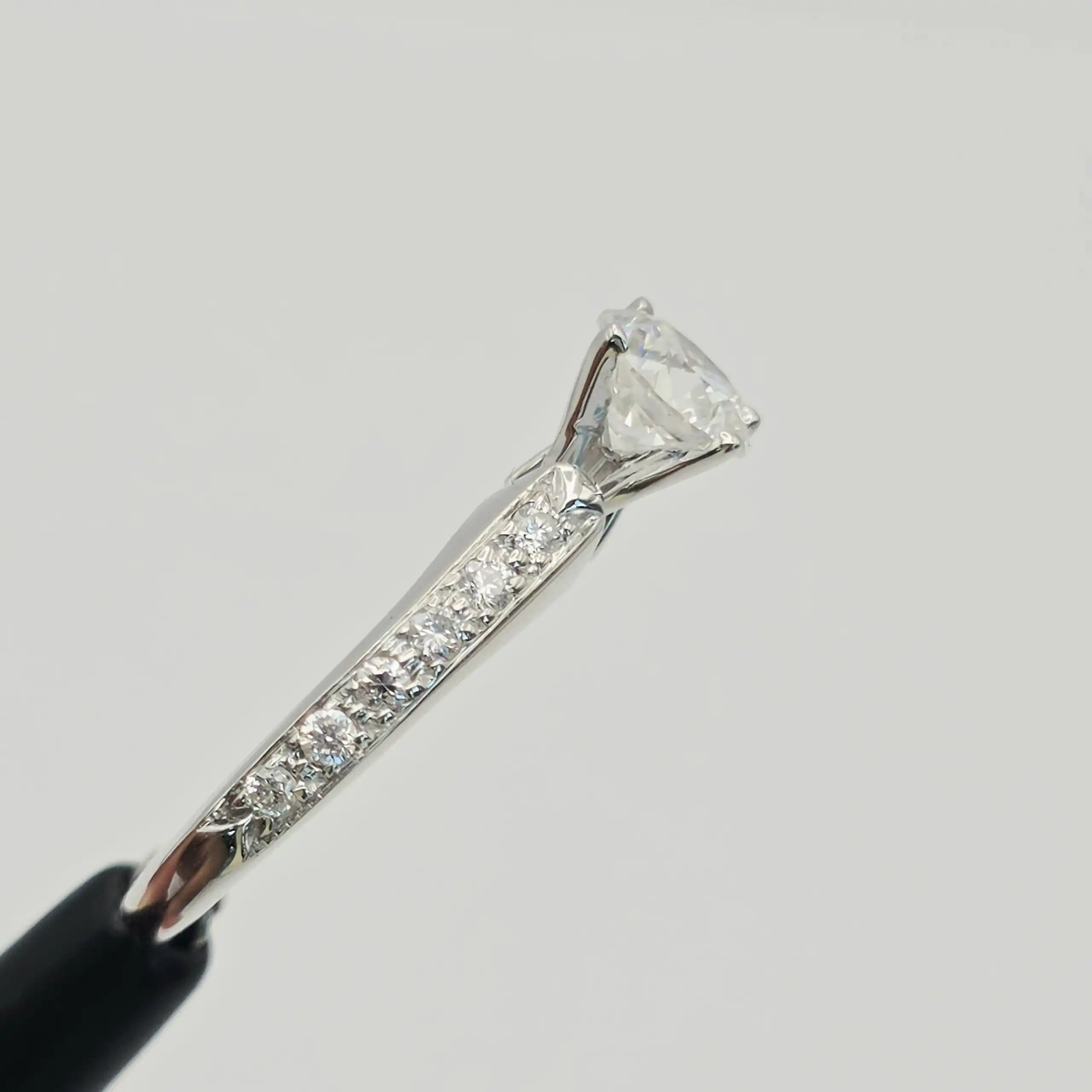 0.70 cts round natural diamond solitaire ring with pave shoulders in 14K white gold
