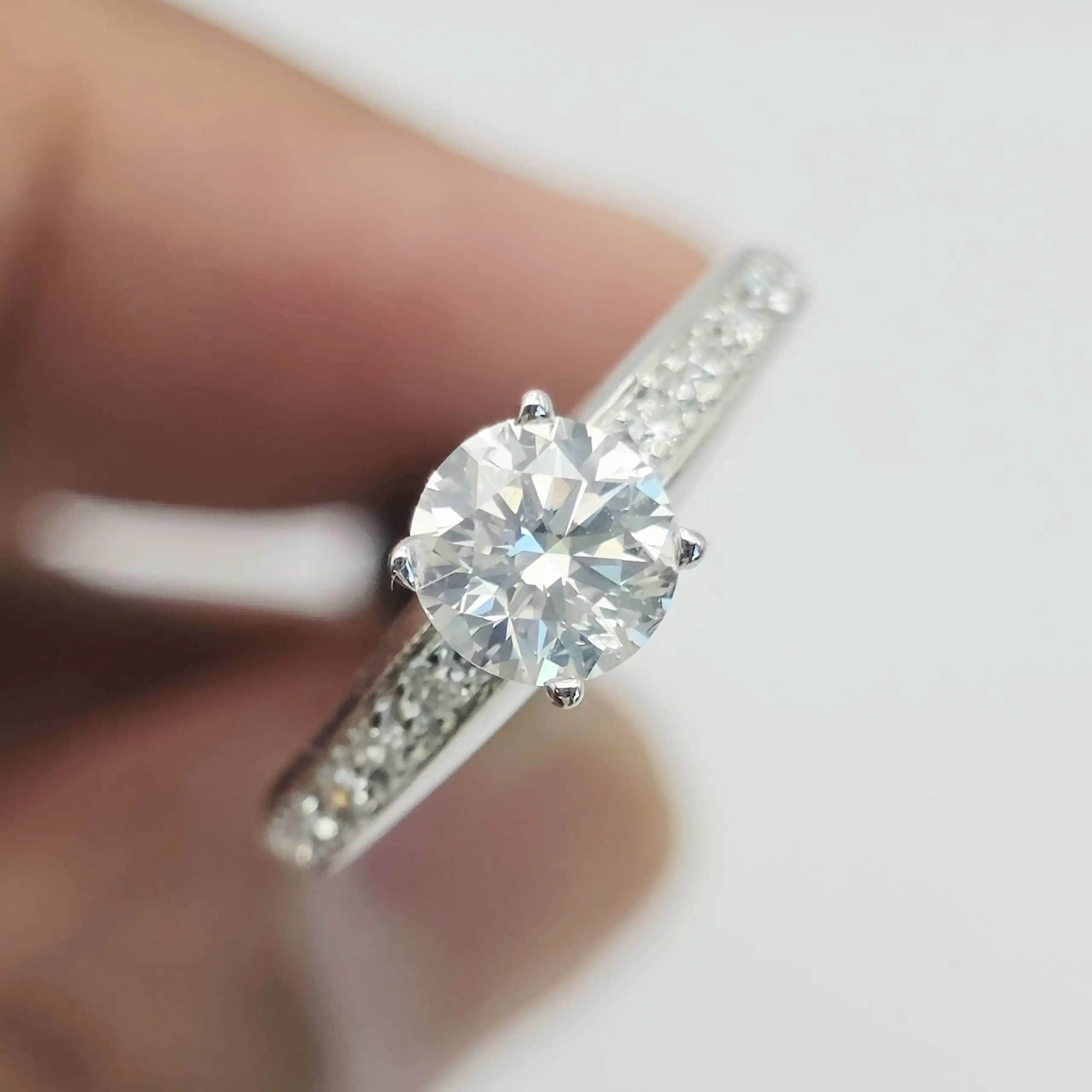 0.70 cts round natural diamond solitaire ring with pave shoulders in 14K white gold