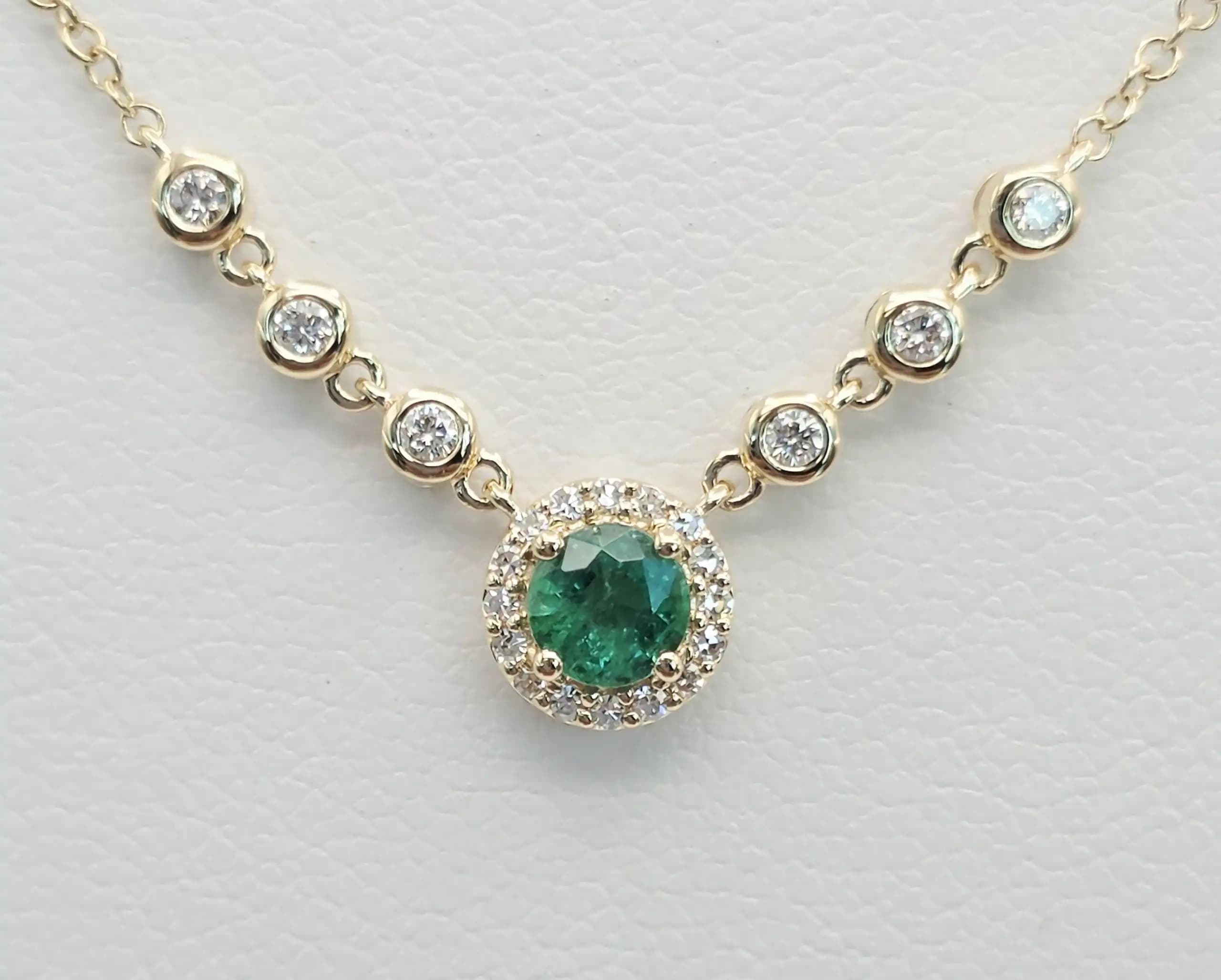 0.08 cts natural emerald and diamond curved bar necklace in 14K yellow gold