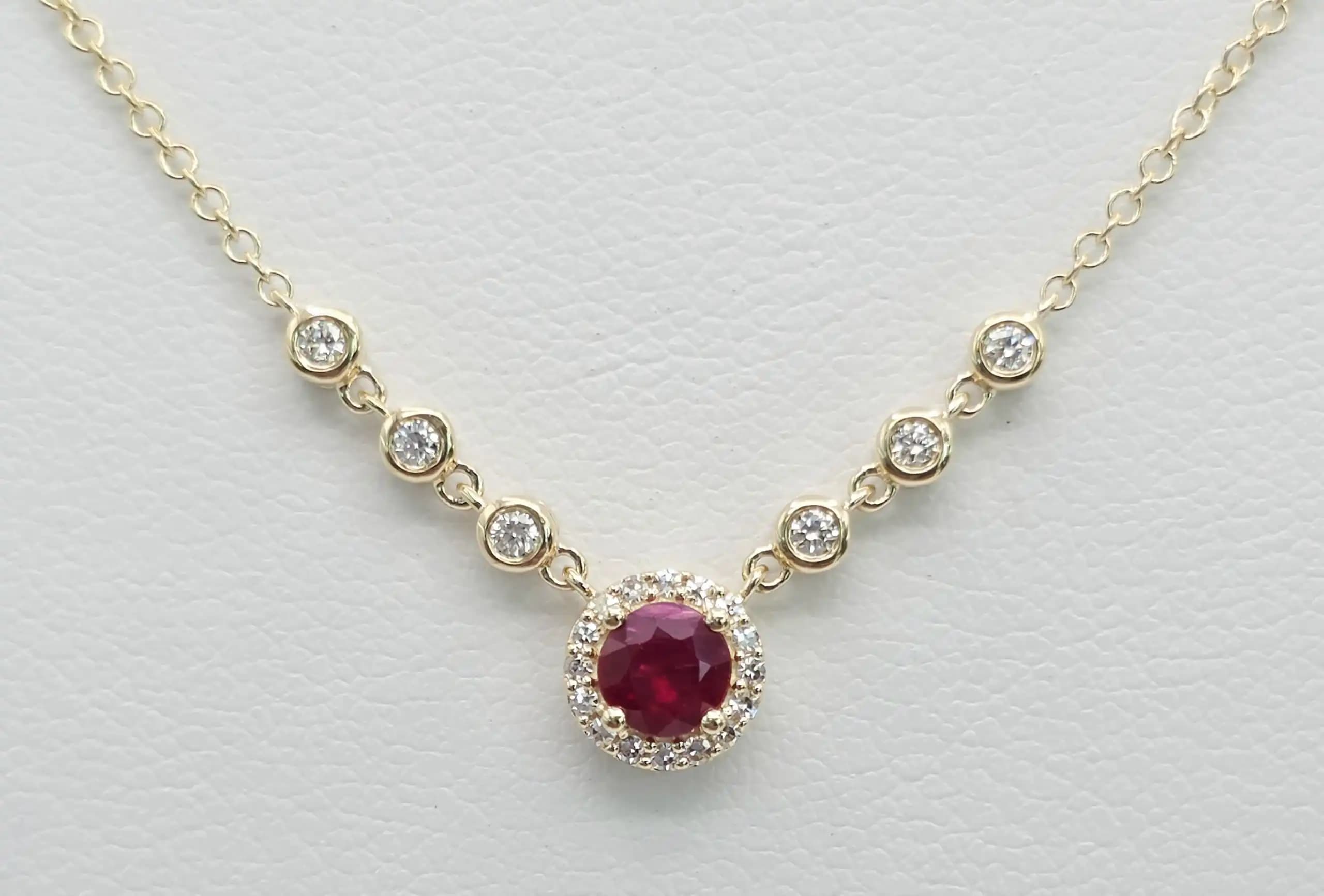 0.05 cts natural ruby and diamond halo necklace in 14K yellow gold