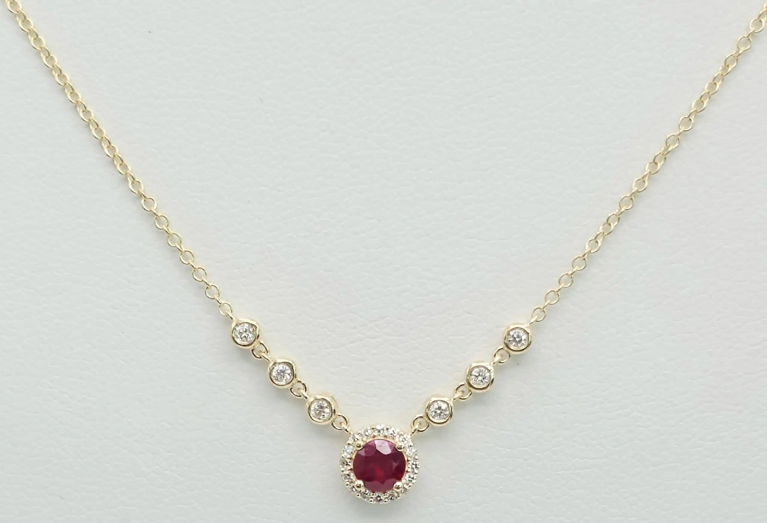 0.05 cts natural ruby and diamond halo necklace in 14K yellow gold