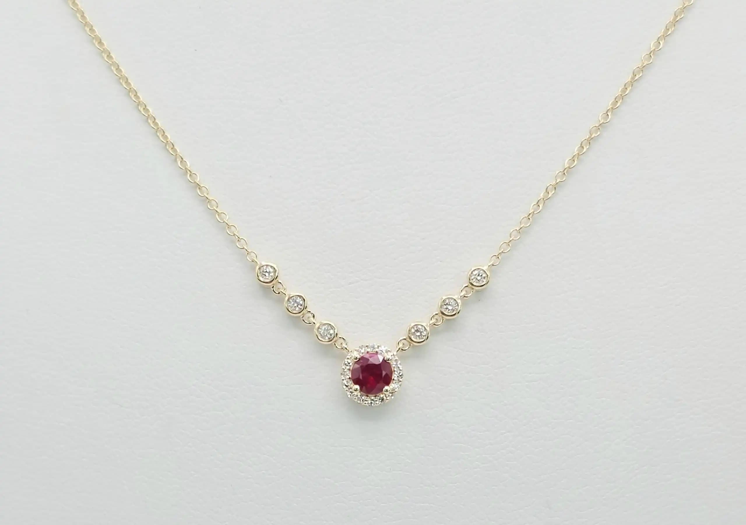 0.05 cts natural ruby and diamond halo necklace in 14K yellow gold