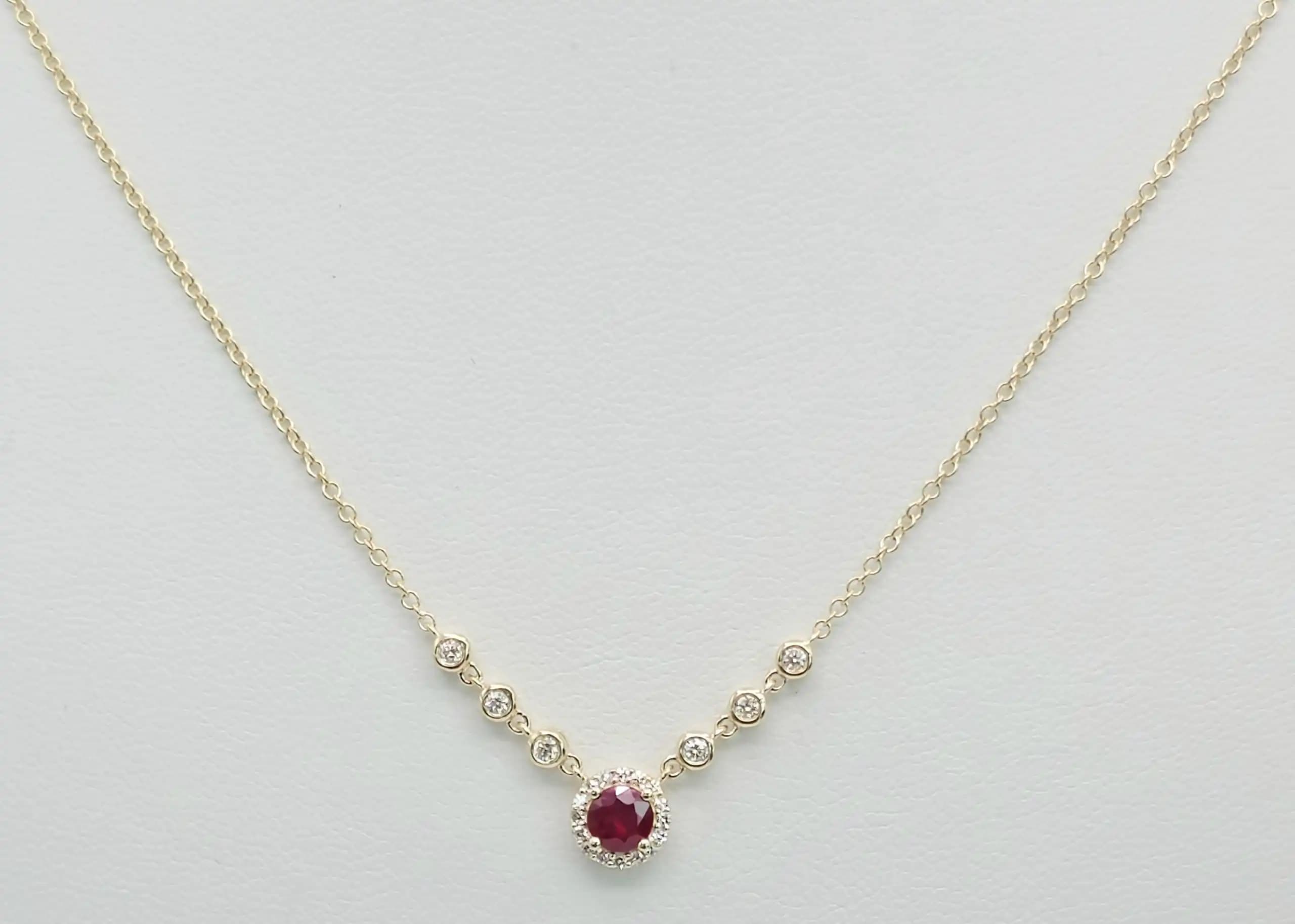 0.05 cts natural ruby and diamond halo necklace in 14K yellow gold