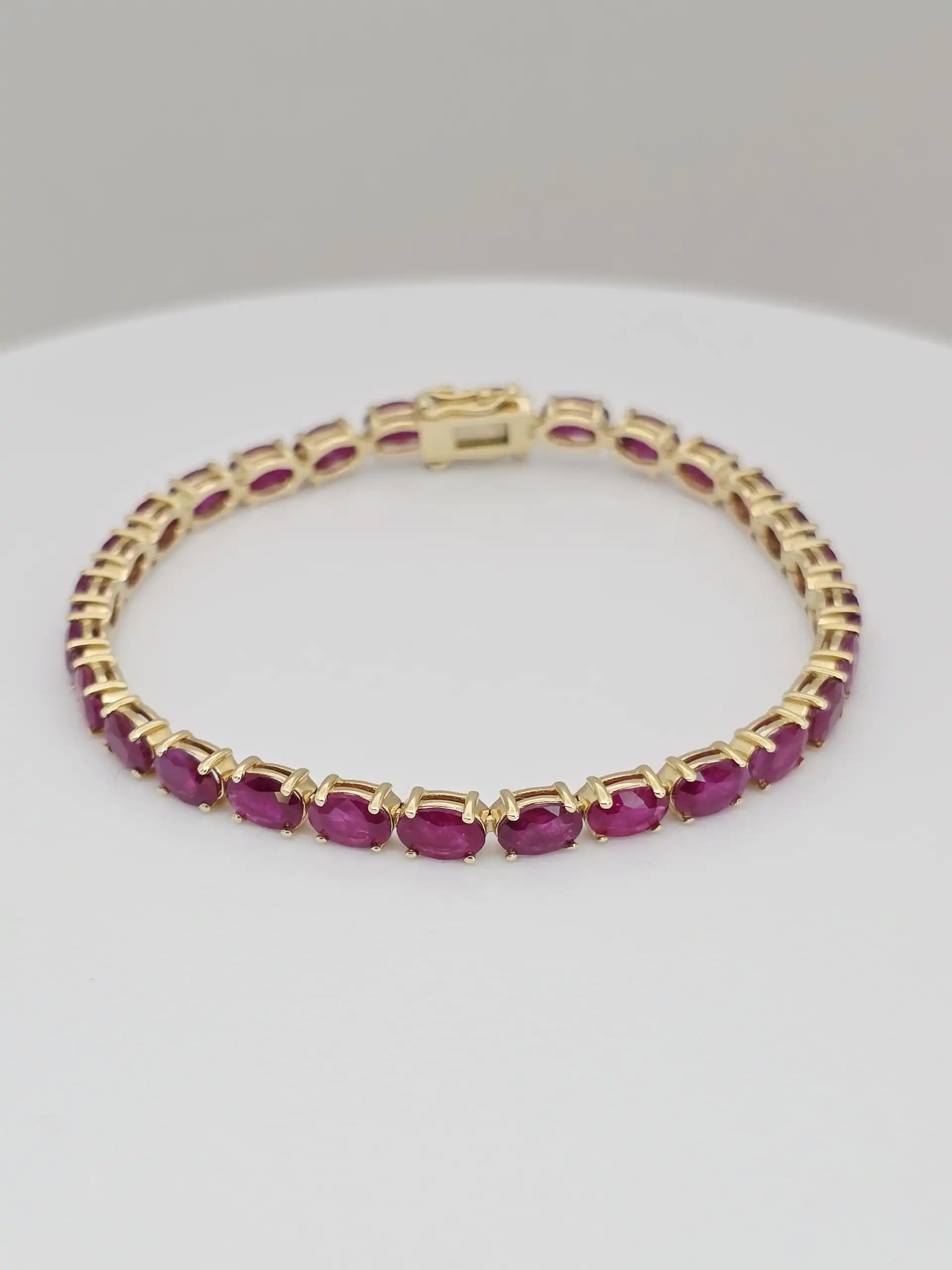 14.63 cts Oval cut natural ruby tennis bracelet in 14K white gold