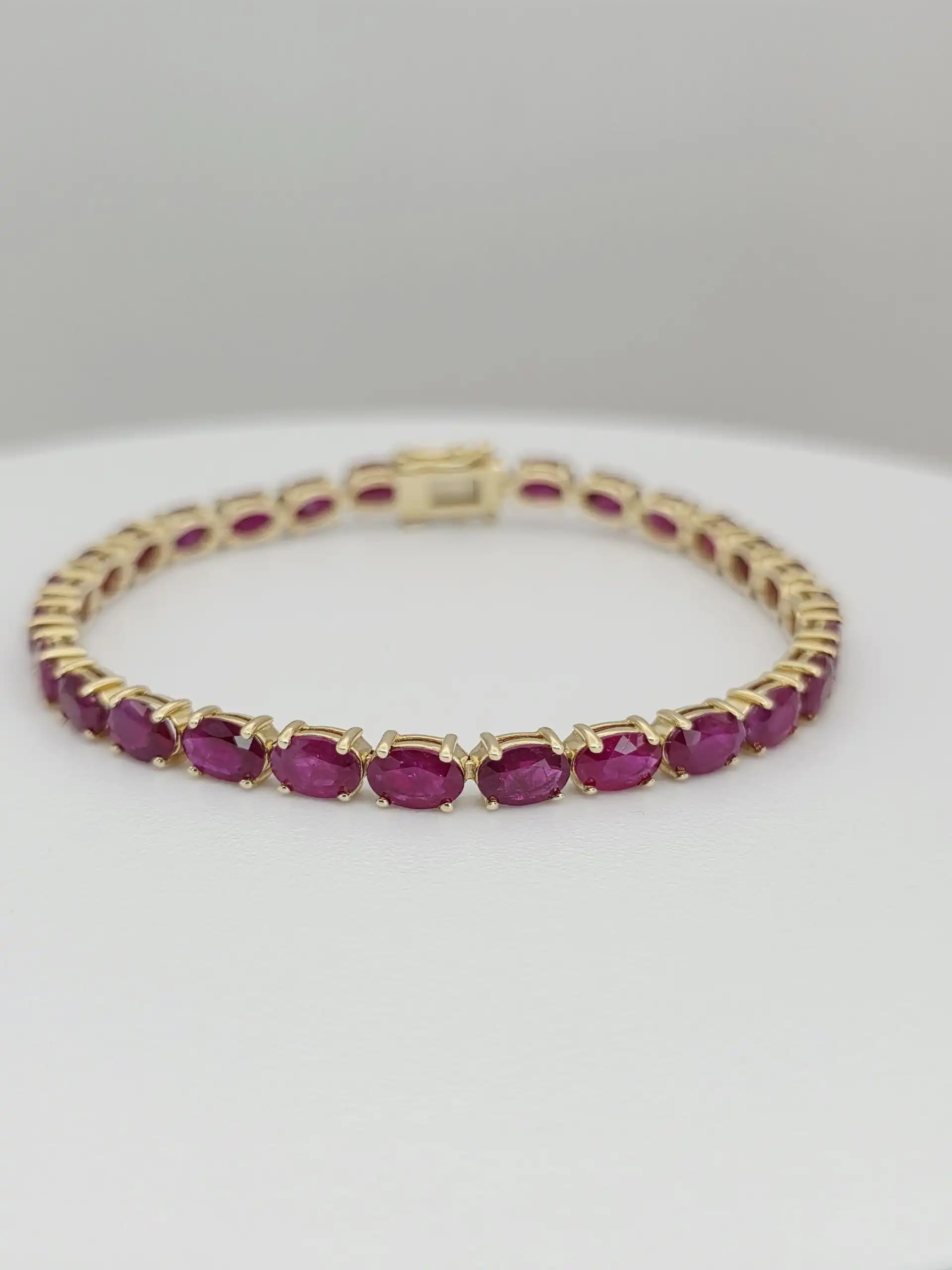 14.63 cts Oval cut natural ruby tennis bracelet in 14K white gold