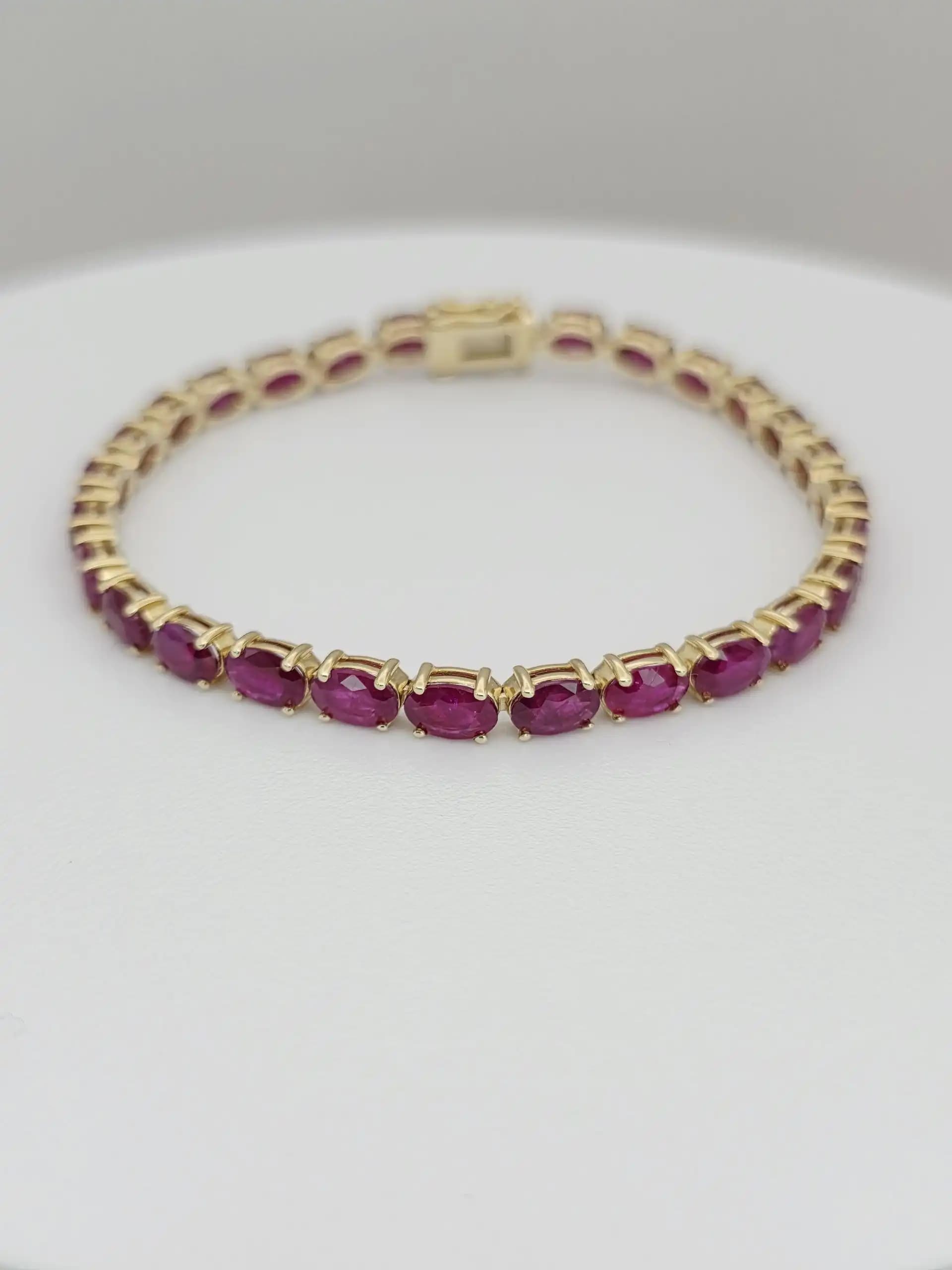 14.63 cts Oval cut natural ruby tennis bracelet in 14K white gold