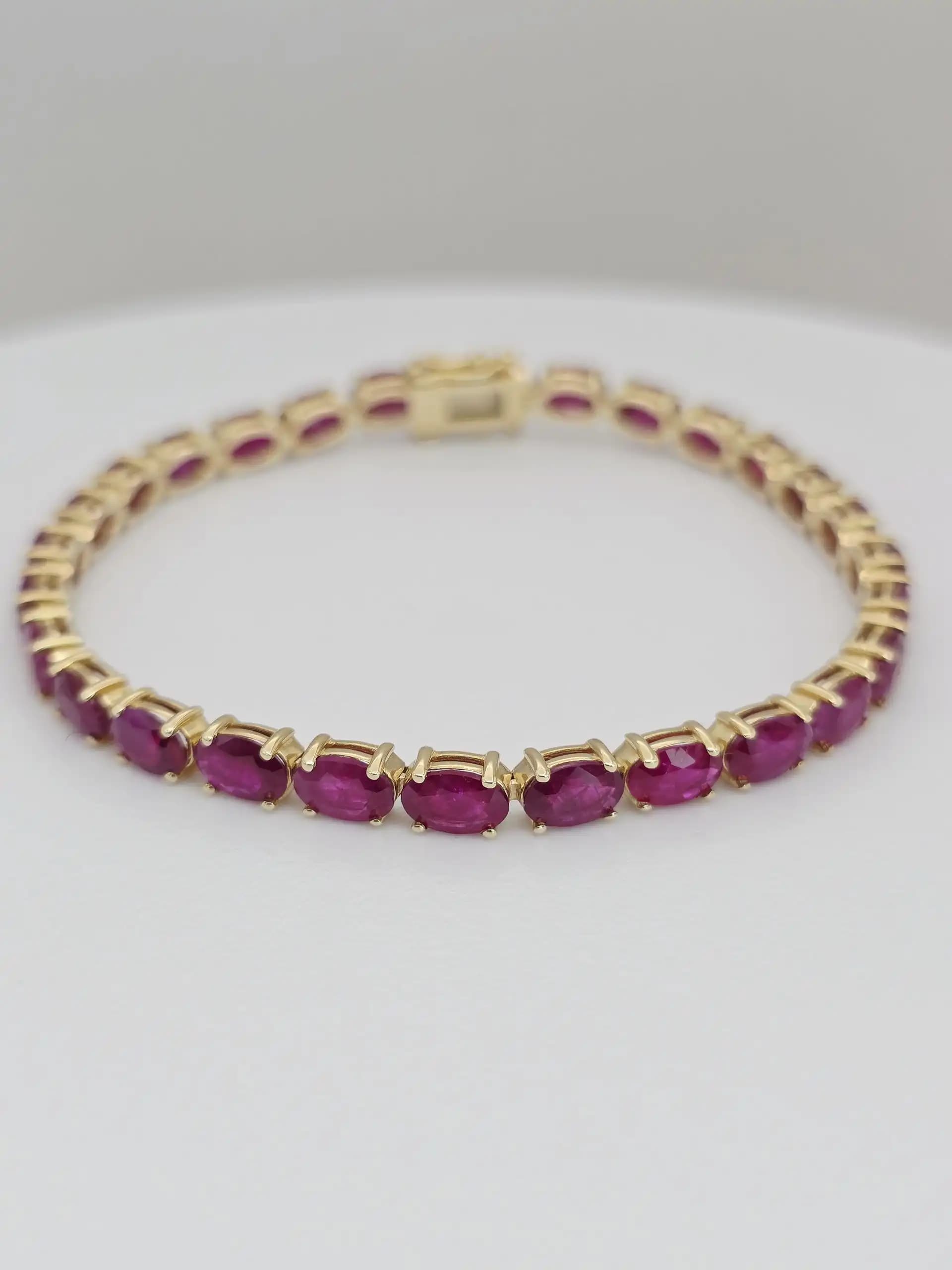 14.63 cts Oval cut natural ruby tennis bracelet in 14K white gold