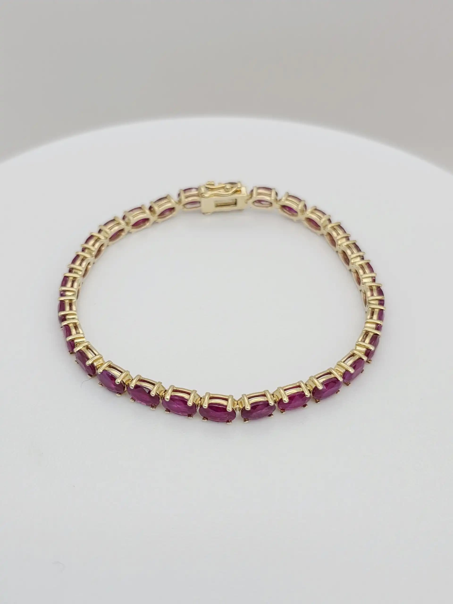 14.63 cts Oval cut natural ruby tennis bracelet in 14K white gold